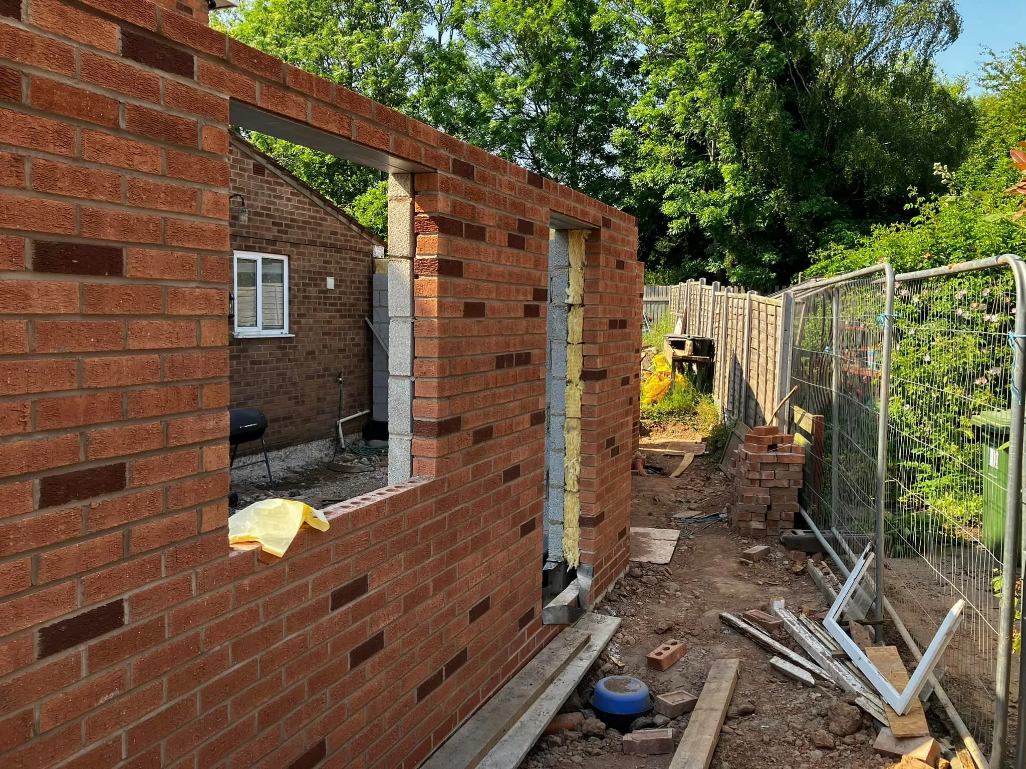 A brick wall with a hole in the middle of it.