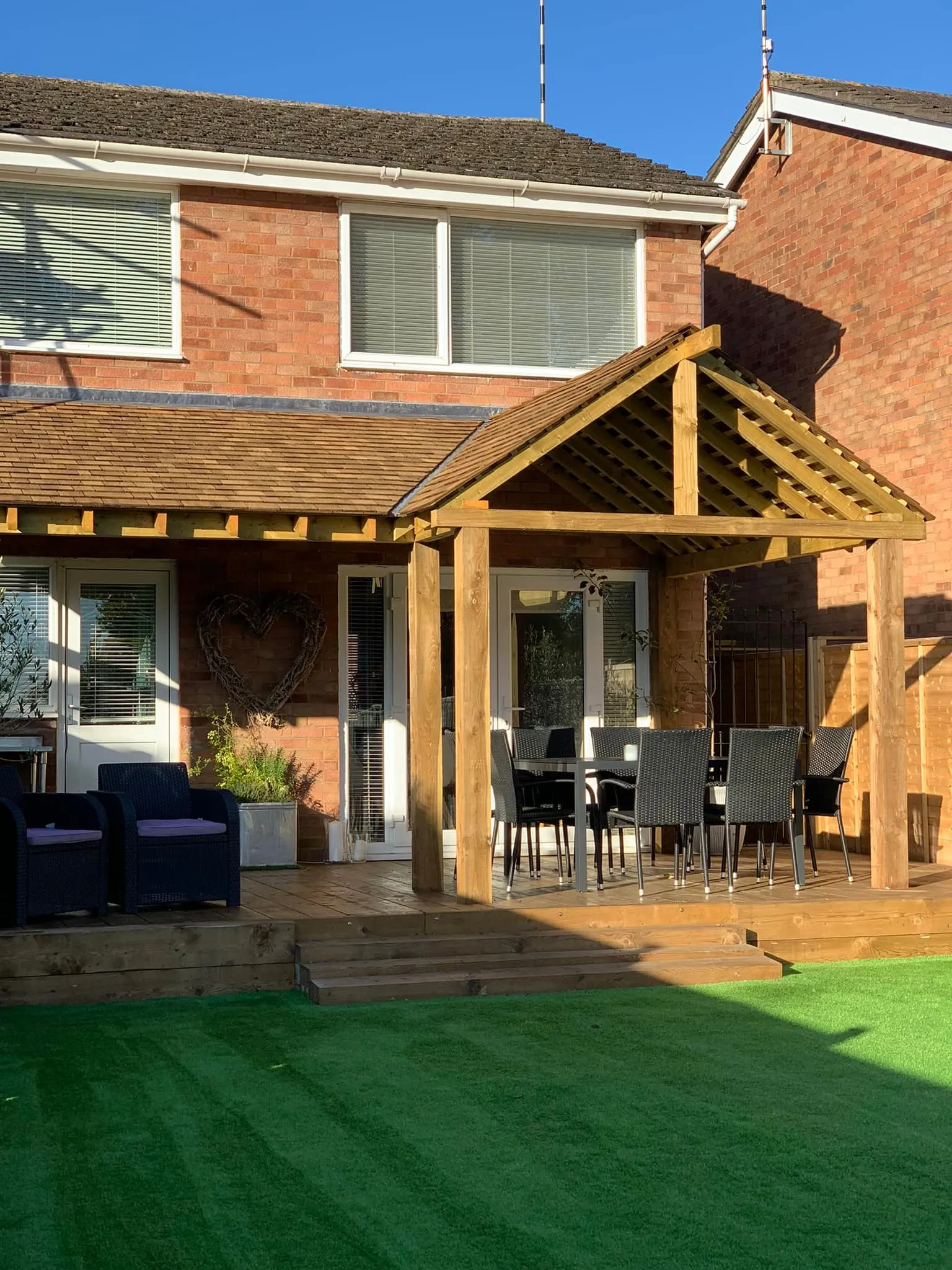 A patio with a table and chairs on it.