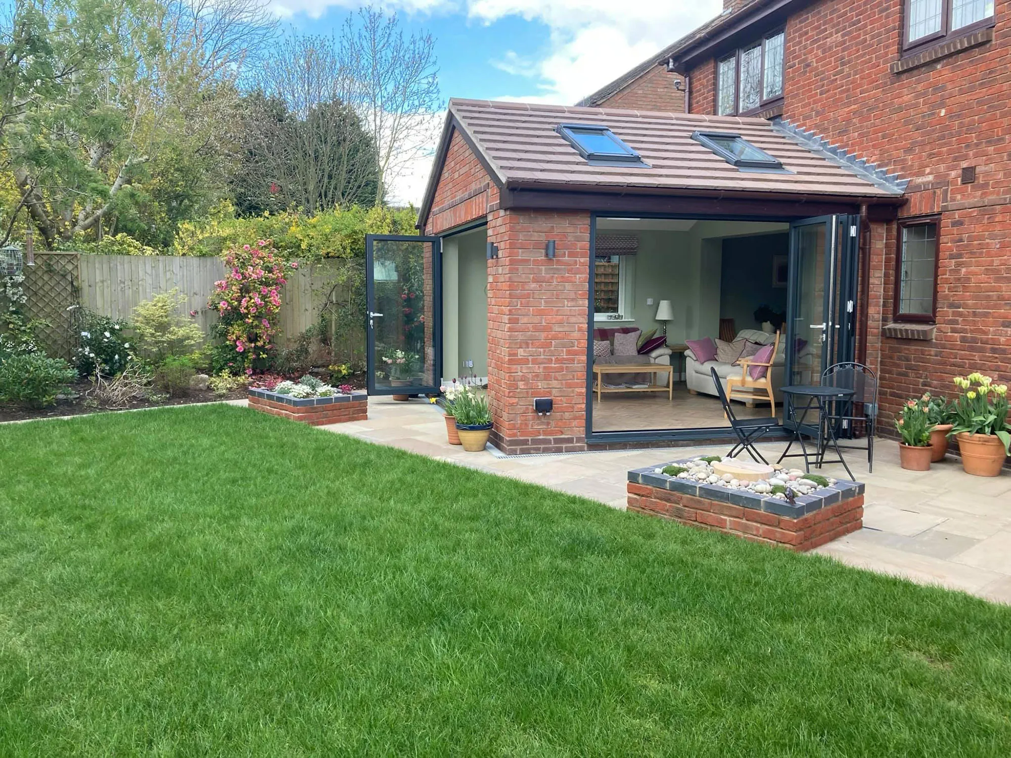 A patio with a table and chairs in it.